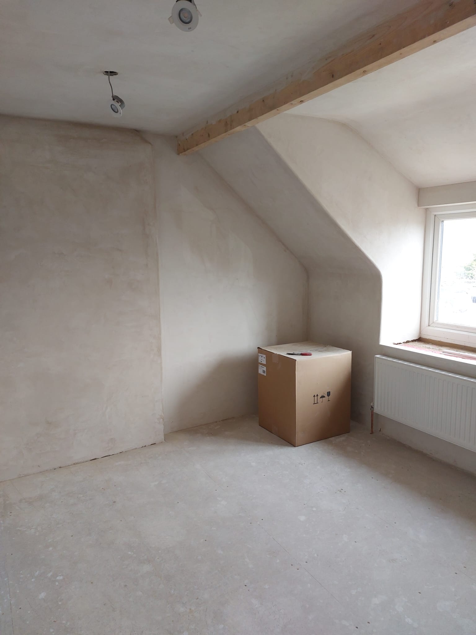 Loft room plastered from floor to ceiling