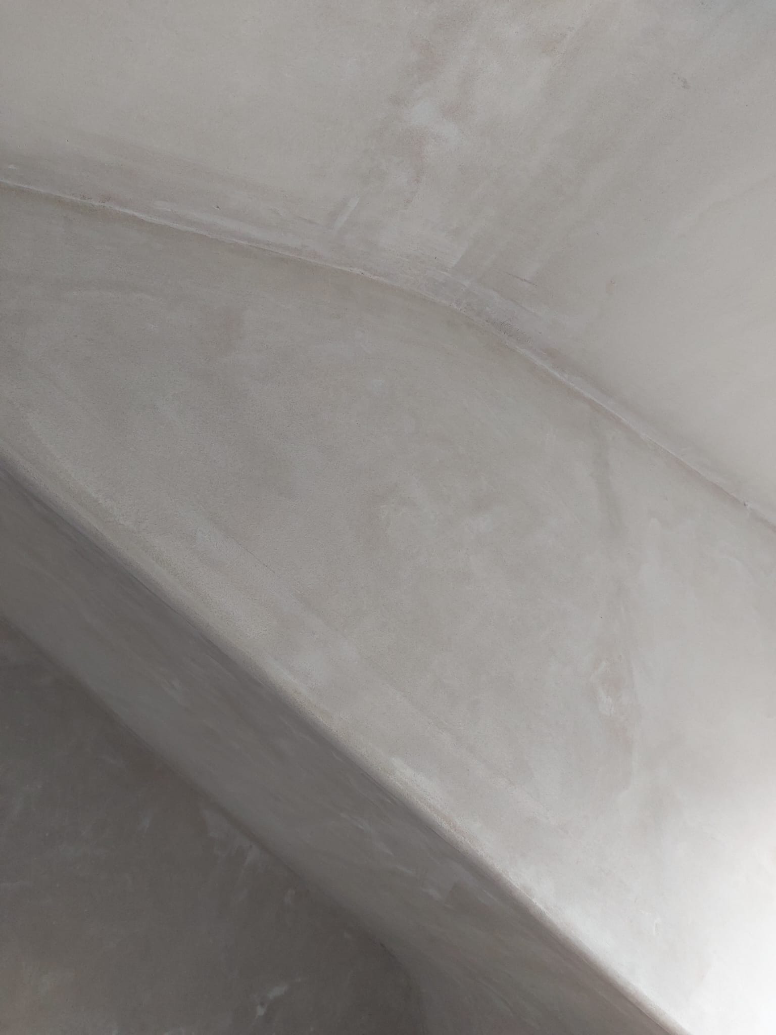Close view of a freshly plastered sloping ceiling